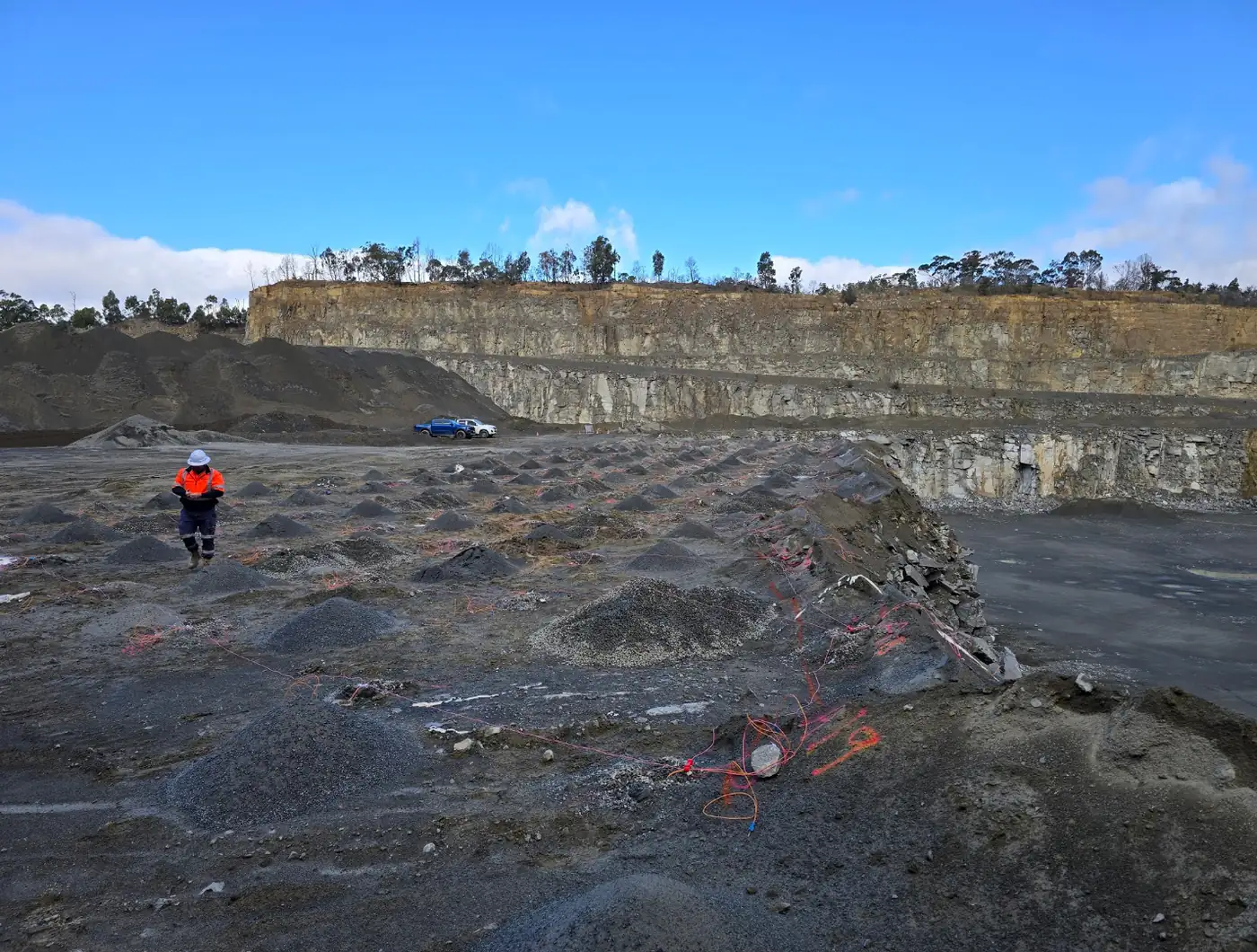 TEXC shotfirer working a tied-in pattern on a quarry bench
